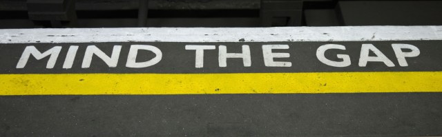 Mind The Gap sign on tube  station platform in London UK